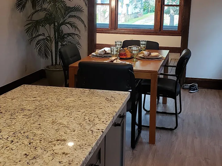 Semi open kitchen concept looking into living room. Window seat would be on the right of this picture. Large window in rear of picture is the front of the house overlooking the front porch.