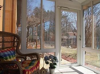 Enjoy sunny days-even in the winter in this lovely sun room located off the kitchen.  What a great place to curl up with a book or a morning cup of coffee!