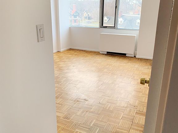 Large bedroom, with large closet & wall to wall window.