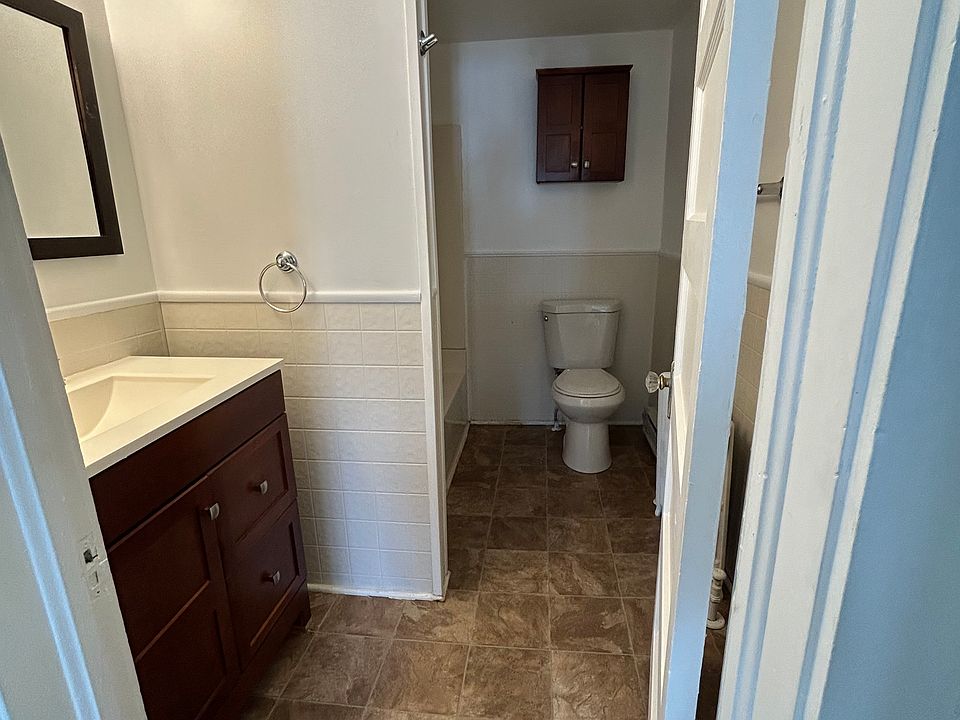 Updated bathroom includes a tub/shower combo with new vinyl flooring