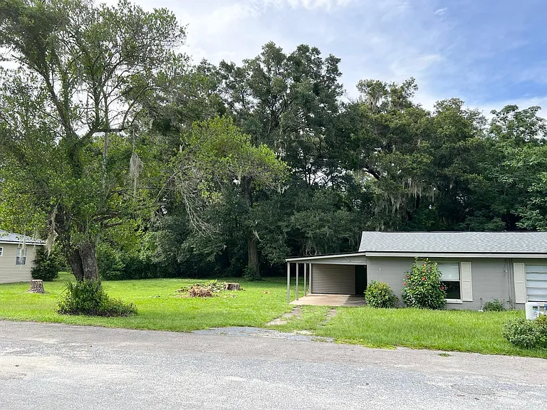 Front Angled Photo showing 1313 NE 33rd and large usable yard