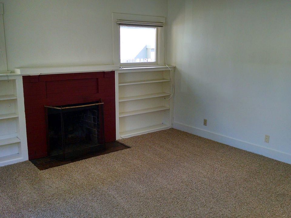 Fireplace, built-in bookshelves, new carpet