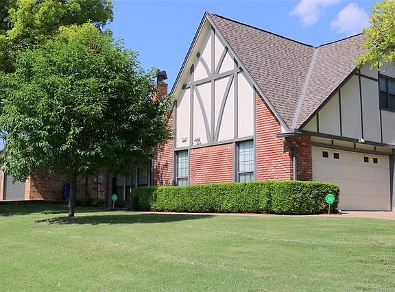 The home sits on a pretty corner lot with a side entry garage.