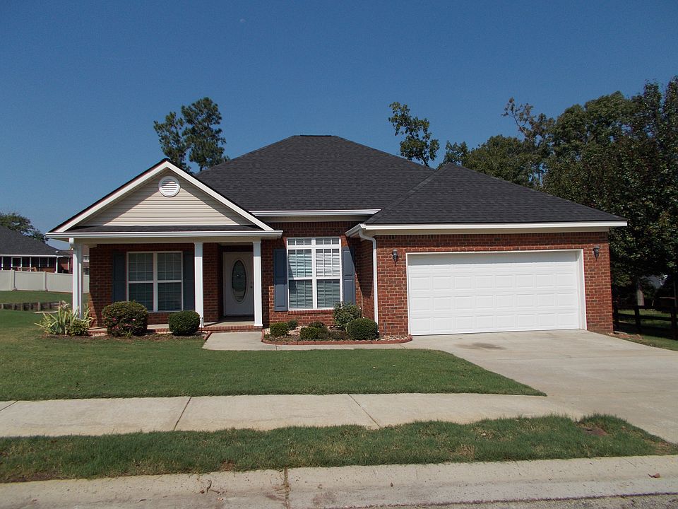 front facade with rocking chair front porch.