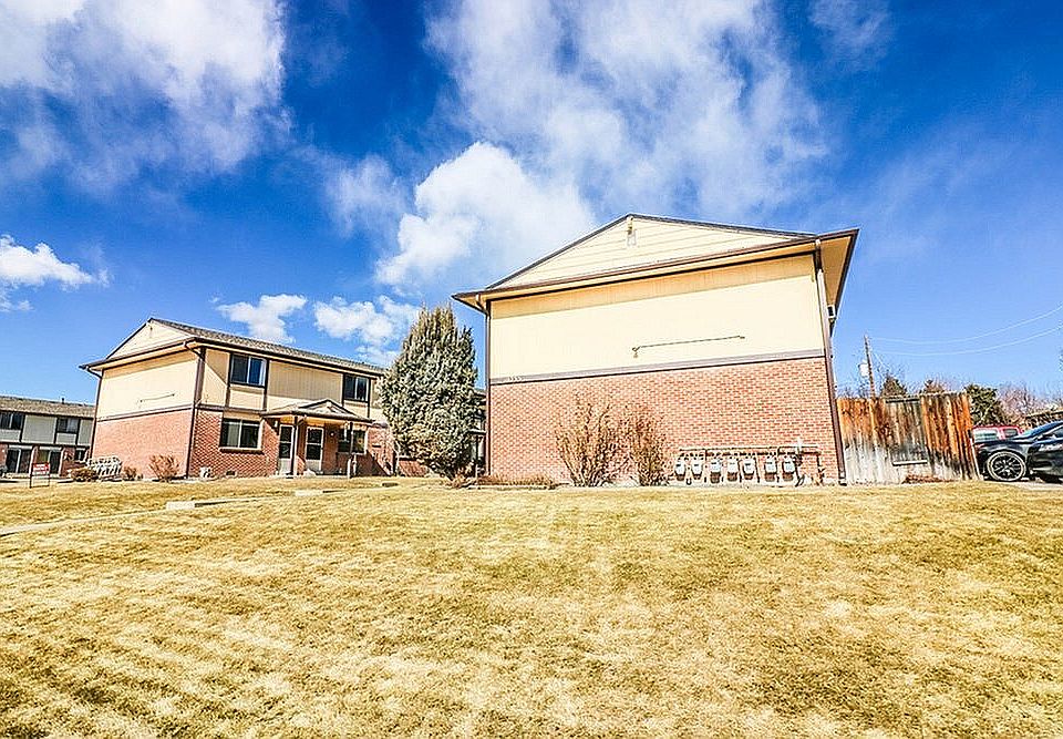 Explore this charming dual-unit residence, featuring bright exteriors and ample green space.