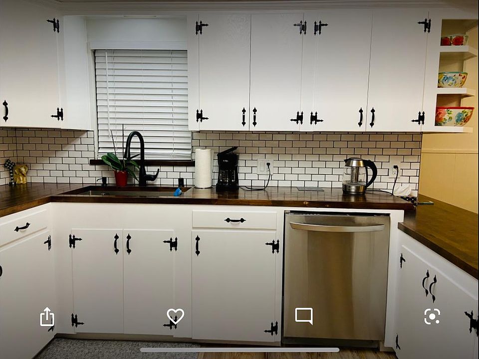 Kitchen- single deep stainless steel sink with touch less faucet, stainless steel dishwasher, butcher block countertop