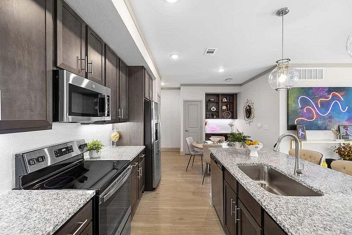 Experience gourmet cooking and dining in this beautifully designed modern kitchen space.