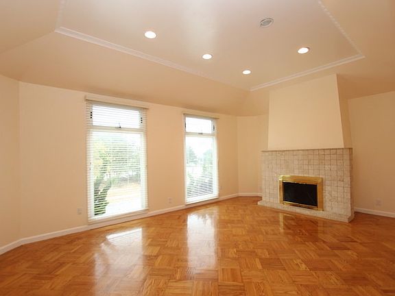 Living Room with tall ceilings and fireplace