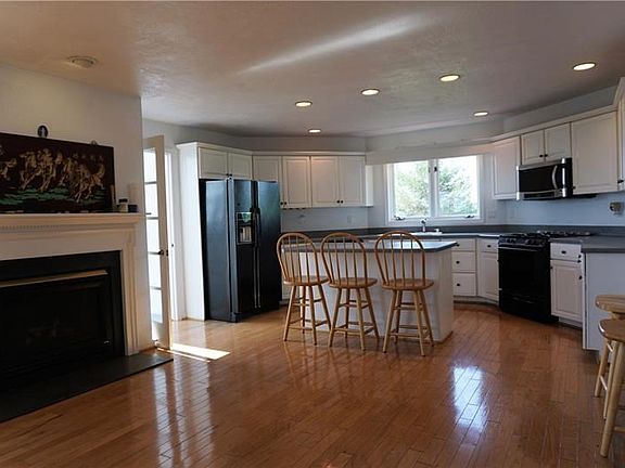 Spacious kitchen and another door to sunroom.