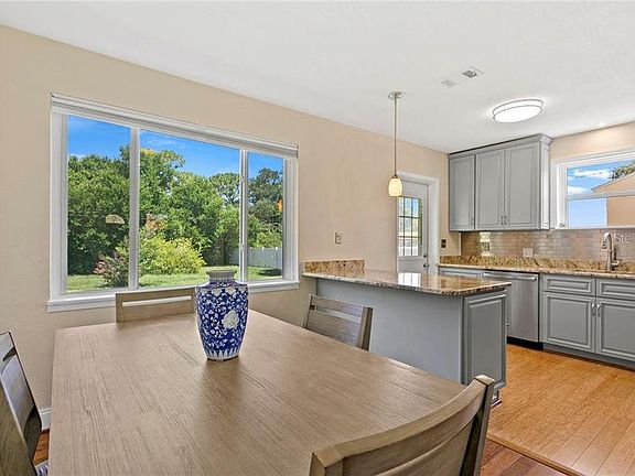 Open floor plan kitchen and dining room. Big windows with lots of natural light.