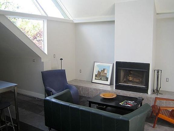 Living room with wood burning fireplace