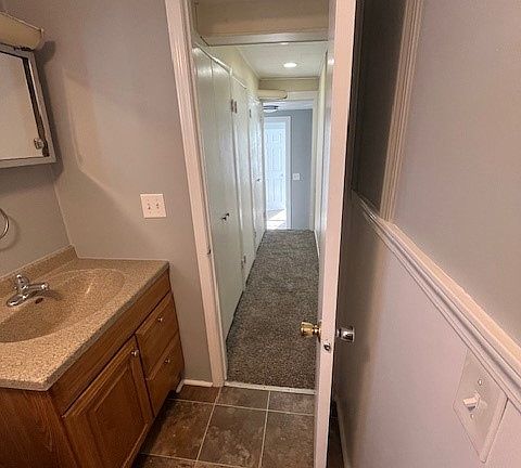 Shower, no tub
hallway with storage