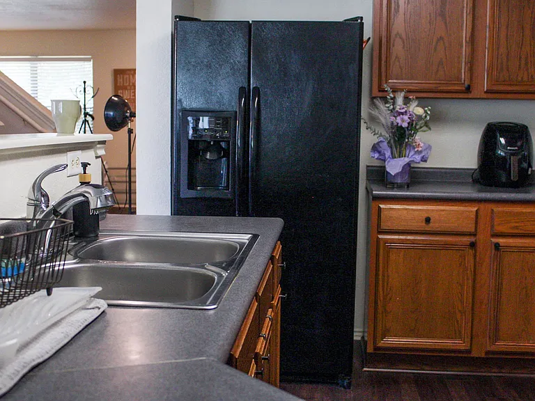 Fully equipt kitchen a fryer, microwave, toster and more.