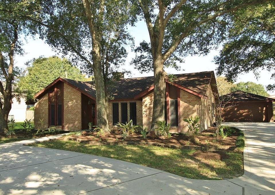 OVER AN ACRE! A circular driveway sweeps around in front of this Beautiful One Story, Four Bedroom Home that also has a long driveway to the detached garage.