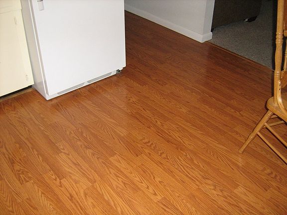 Laminate flooring in kitchen and hall
