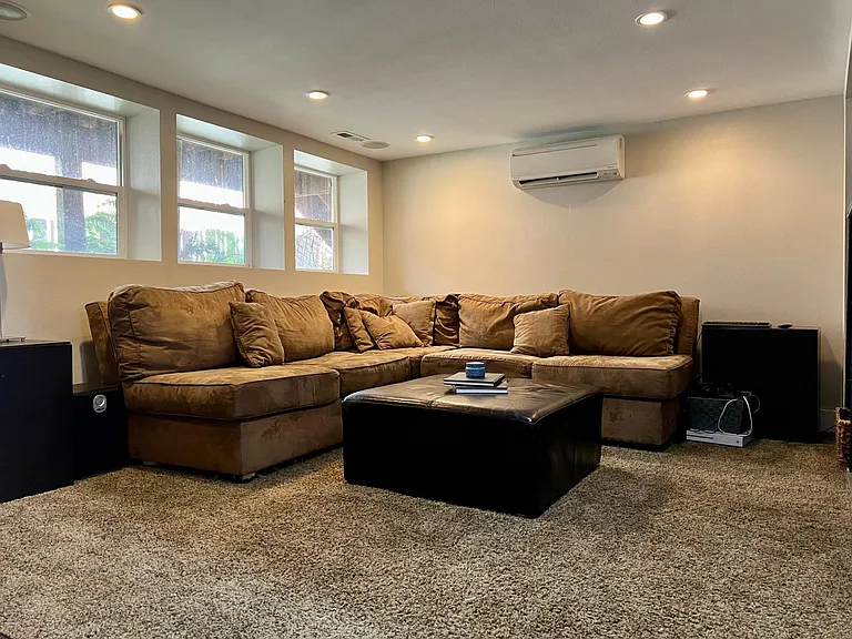 Air conditioning, wall to wall carpet. This level also connects to laundry and storage under the stairs, the garage and workshop off of the garage.