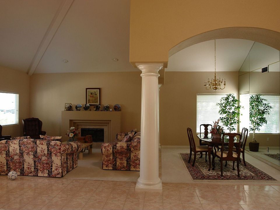 Living w/fplc, dining with mirrored wall