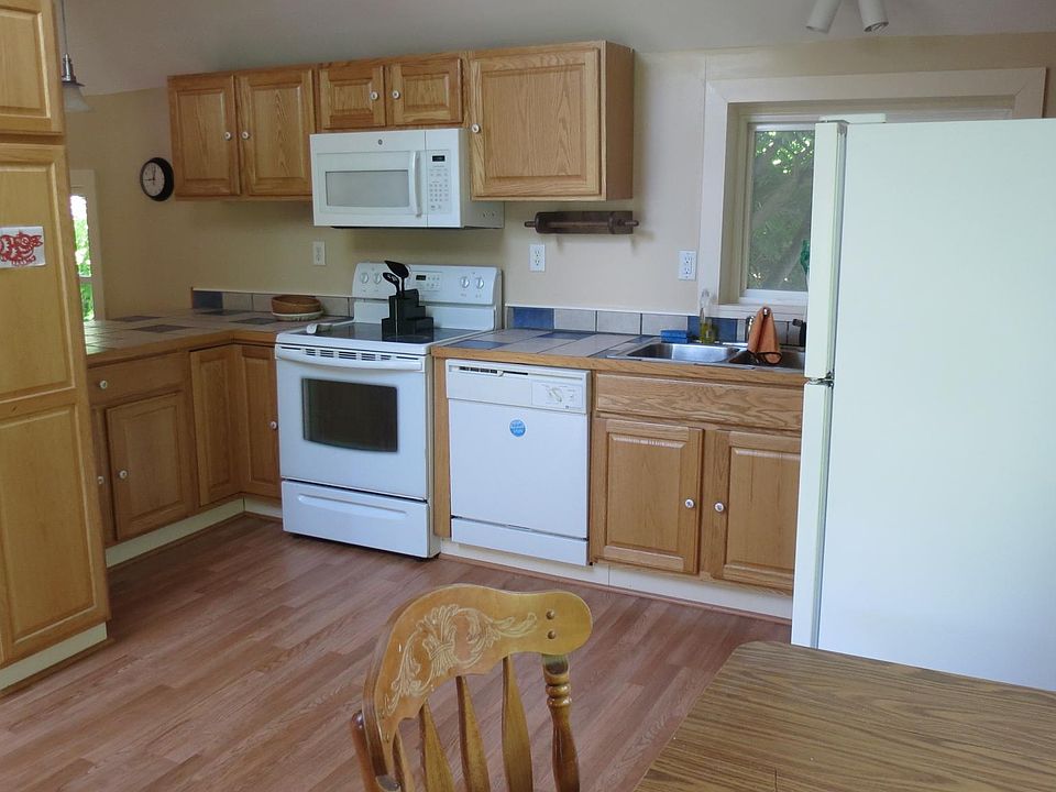 An overhead skylight in the kitchen and lots of windows make