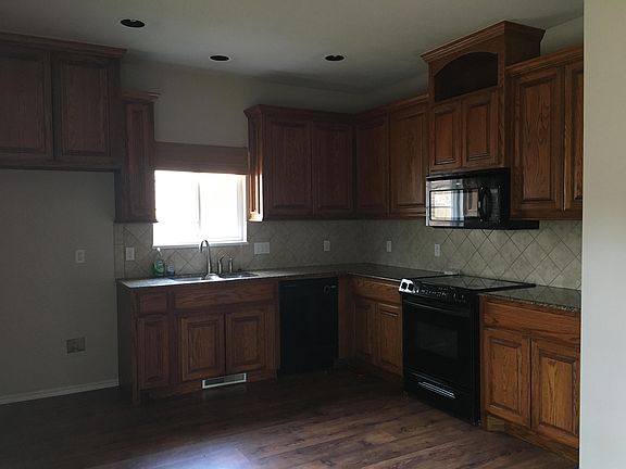 Nice open kitchen with sliding glass door to backyard