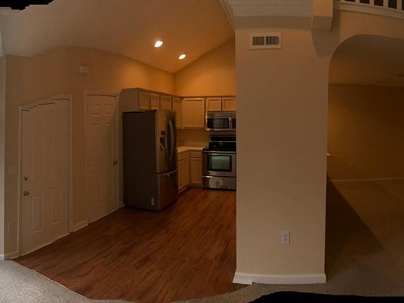 Entryway kitchen/living room and dining area