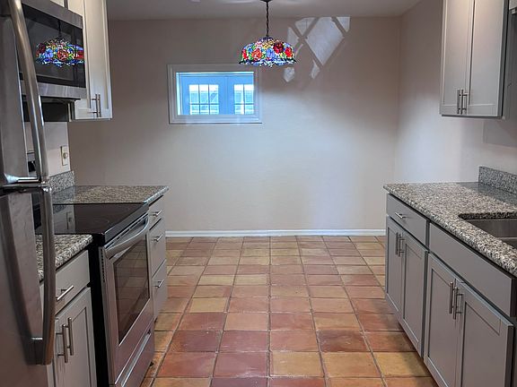 Kitchen with stainless steel appliances and granite counter tops