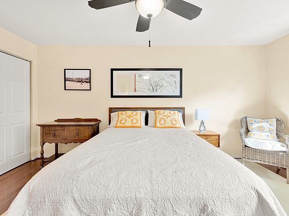 Large primary bedroom has 2 closets with Elfa systems.