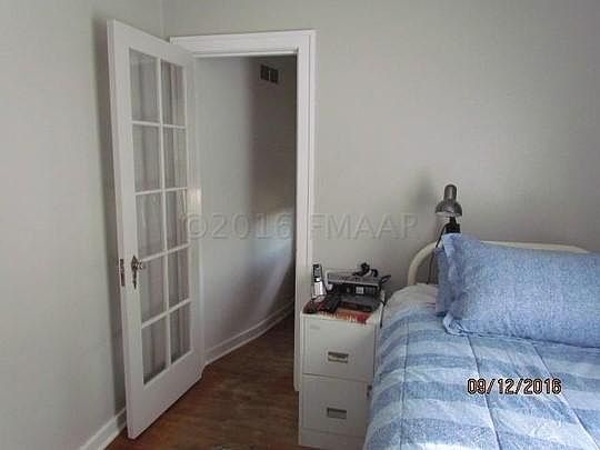 Bedroom one with glass door closet
