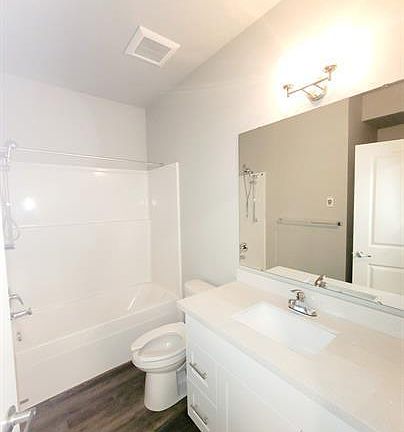 #12 Bathroom w/ stackable washer & dryer.