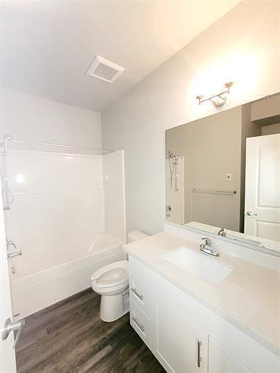 #12 Bathroom w/ stackable washer & dryer.