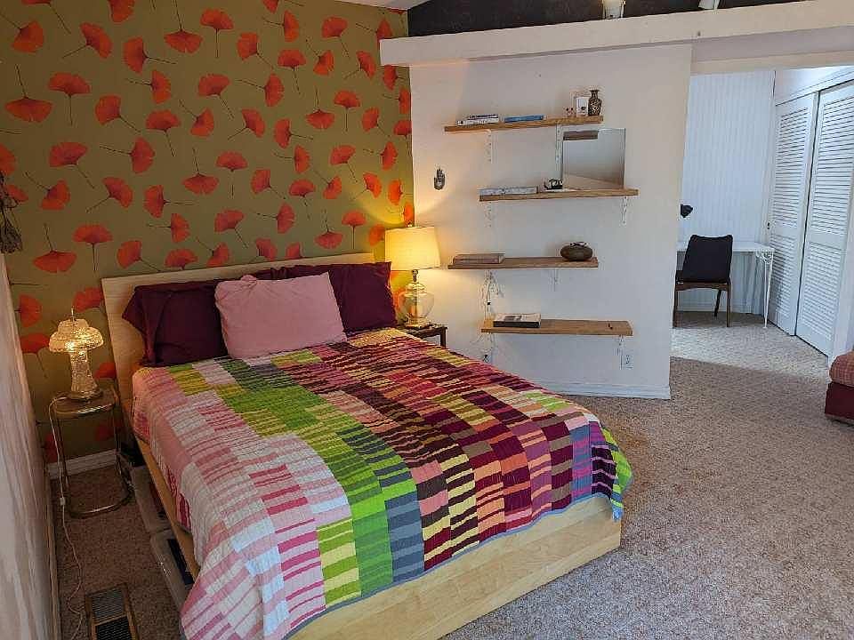 large bedroom with high ceiling