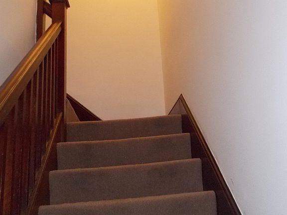 Stairs leading to private upper level
