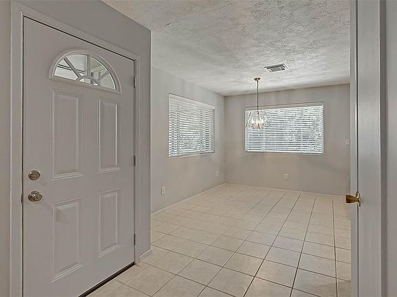Fresh paint looking from Family room to Dining area