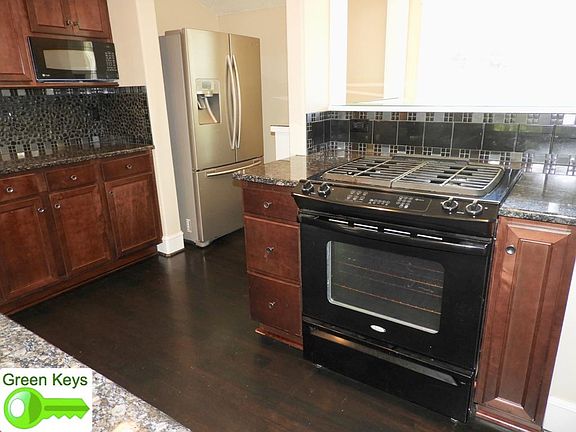 Gas range and stainless steel refrigerator