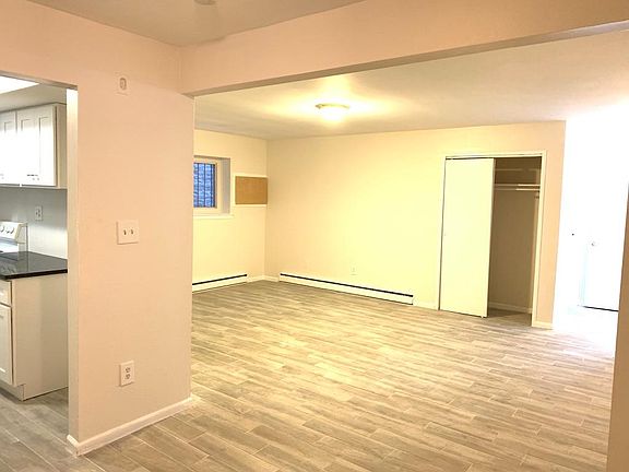 Kitchen and partial view of living room 2/2