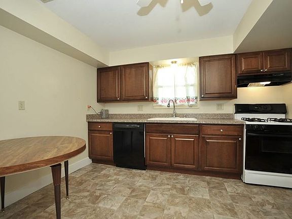 Kitchen with range, dishwasher, fridge