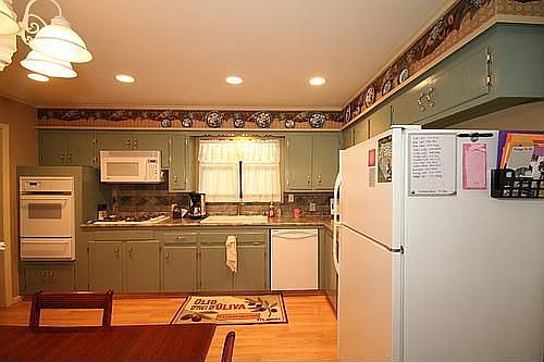 PLENTY OF SPACE IN THIS KITCHEN WITH PANTRY ALSO