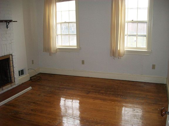 Living Room Front Windows and Fireplace