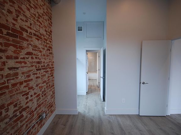 Bedroom w walk-through closet to bathroom