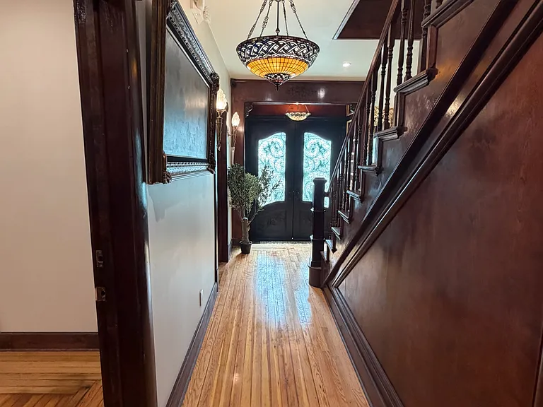 entrance to 1st floor apartment. additional storage under steps