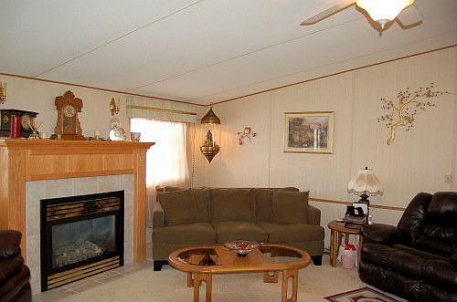 Living room features vaulted ceilings and cozy gas fireplace.