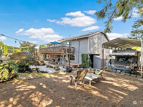 Open area, could be a fire-pit. RV parking with power.>