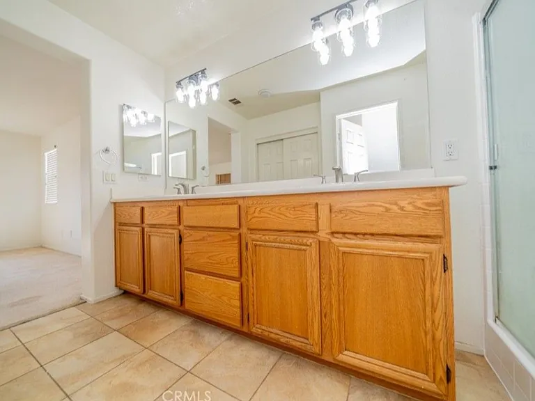 This picture shows the Master bathroom. There are two full bathrooms upstairs (the master bathroom and the hall bathroom) and a half bathroom downstairs.