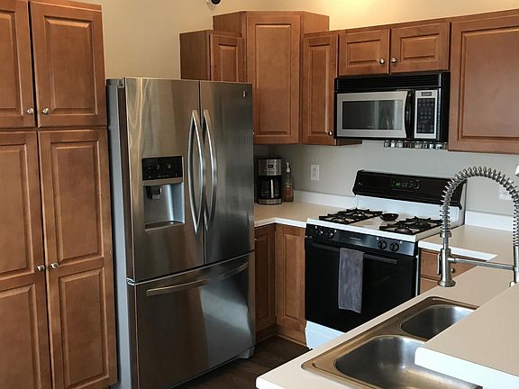 Kitchen with updated stainless steel refrigerator, dishwashe