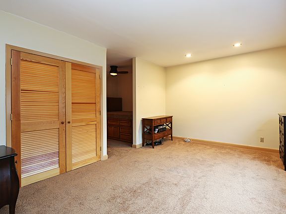 Sizable Living Room with Bedroom Alcove