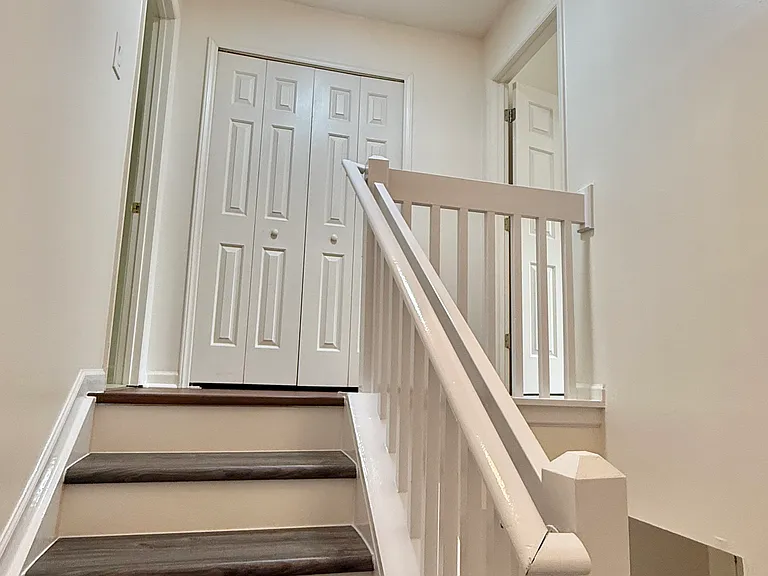 Second Floor: Primary bedroom, second bedroom, and a centrally located storage closet.