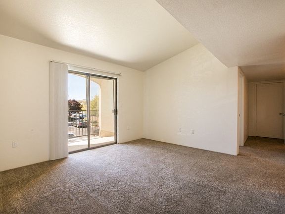 Large living room with private balcony access