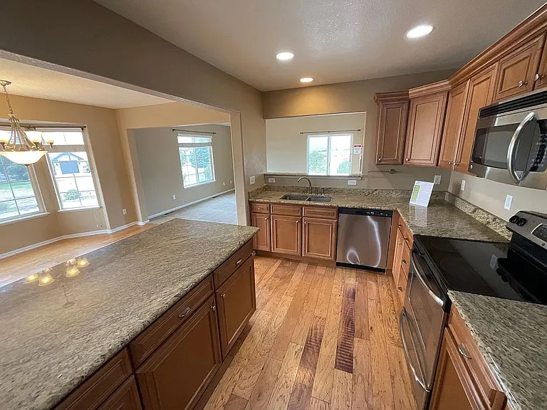 Gourmet kitchen with stainless steel appliances and granite countertops!