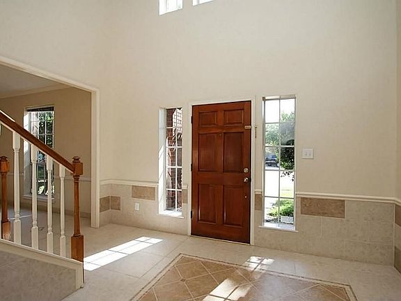 Dramatic 2 Story Entry w/Upper Windows & Unique Inlaid Tile Design