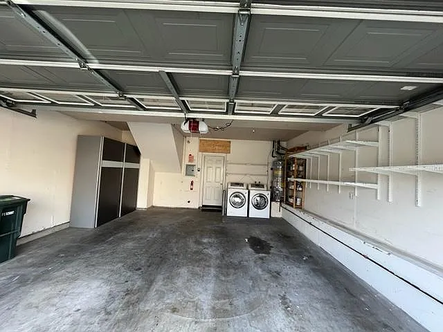 two car garage with washer and dryer