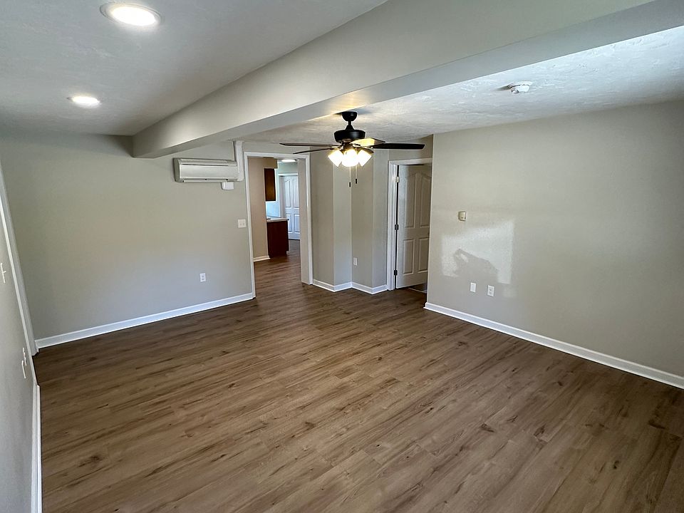 From the front door viewing the large living room. Ceiling fan with light.